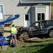 Brewer's drivers upright an SUV through after pulling it through a tight opening next to Penske Truck Rental on Plymouth Rd. on Thursday. Melanie Maxwell I AnnArbor.com